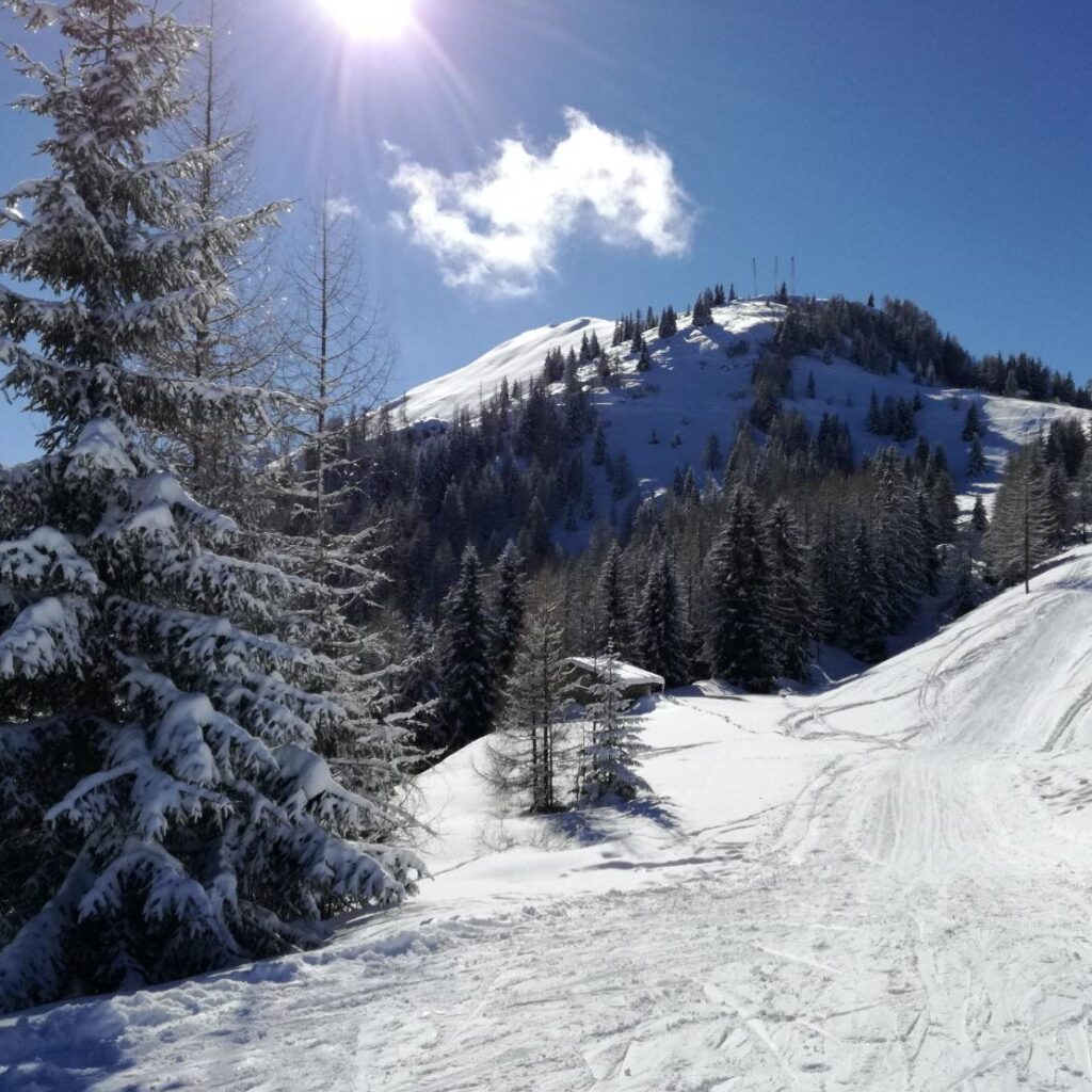 An exhilarating scene in Kaprun: pristine snow blankets majestic mountains, creating a picturesque backdrop for skiing enthusiasts. The crisp air and stunning landscape make Kaprun an ideal destination for winter sports enthusiasts.