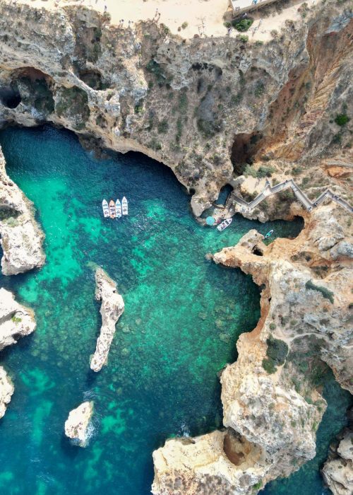 Aerial view of Ponta da Piedade with stunning cliffs and turquoise waters in Lagos, Portugal