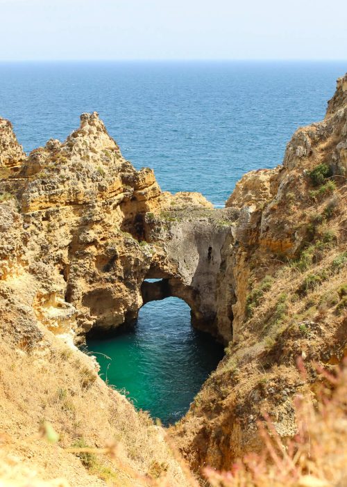 Scenic view from the cliffs of Ponta da Piedade in Lagos, Portugal with golden stone formations and the Atlantic Ocean